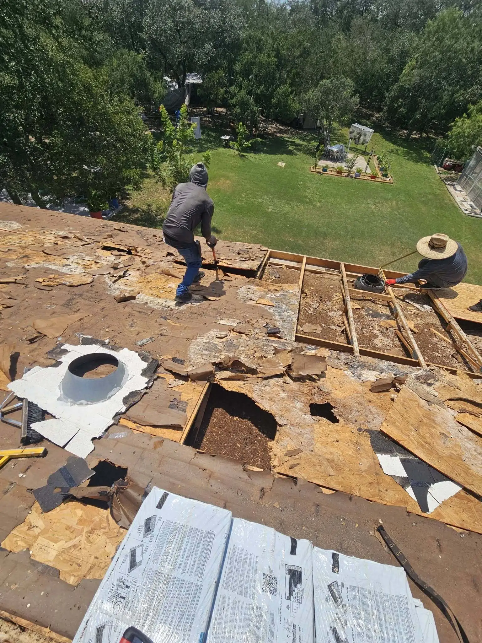 Projects 3 Damaged roof decking exposed during roofing work